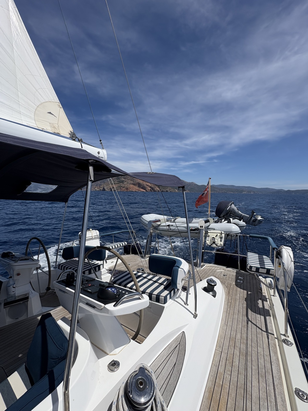 View aft across the cockpit of a sailing yacht during a Mediterranean delivery passage